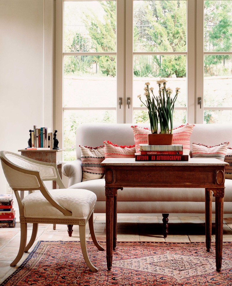 Inspiration for a timeless brick floor living room remodel in Orange County with white walls