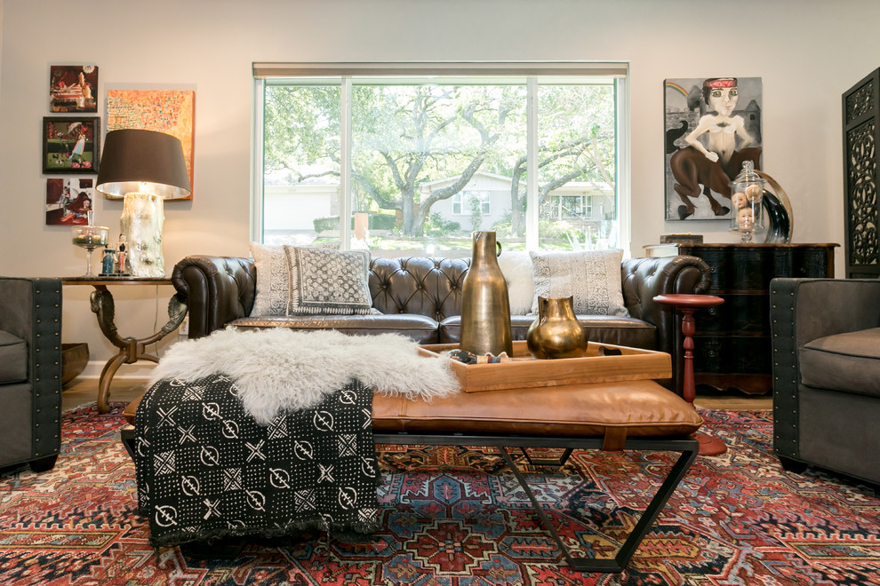 This is an example of an eclectic formal enclosed living room in Austin with beige walls, medium hardwood flooring and beige floors.