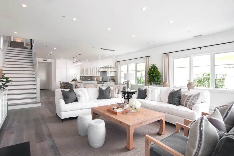 Inspiration for a coastal open concept dark wood floor and gray floor living room remodel in Orange County with white walls and a standard fireplace