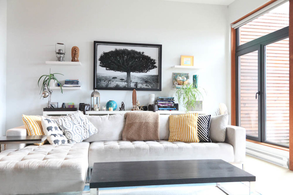 This is an example of a nautical living room in Vancouver with white walls.