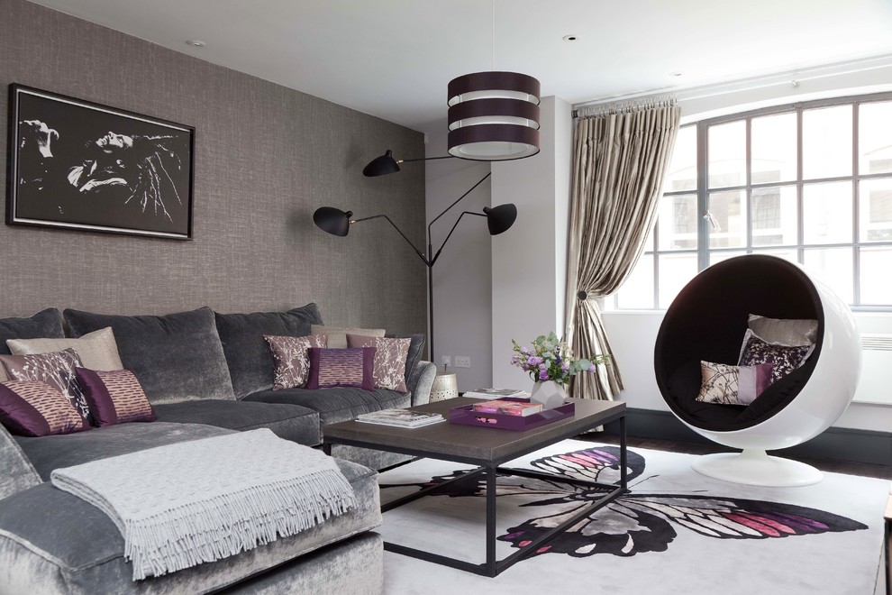 Inspiration for a small contemporary grey and purple open plan living room in London with grey walls and dark hardwood flooring.