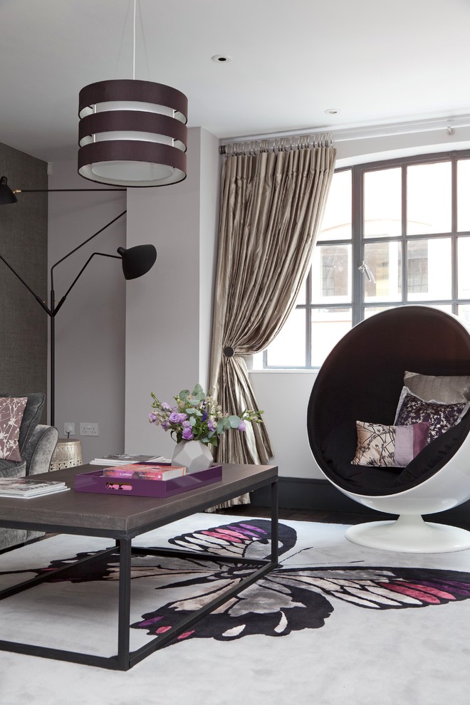 Photo of a small contemporary open plan living room in London with grey walls and dark hardwood flooring.