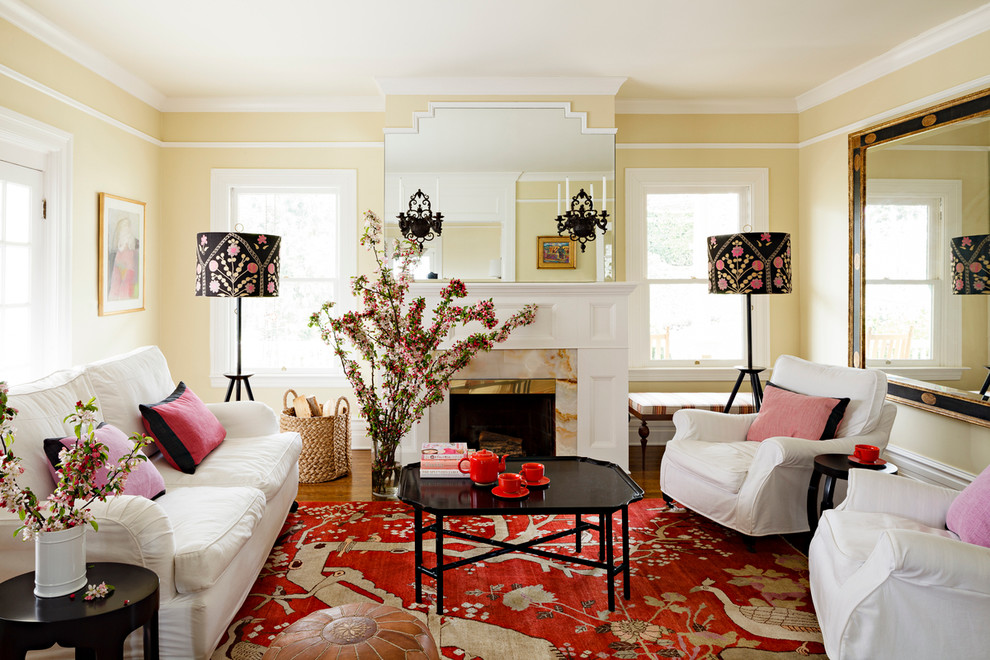 Design ideas for a traditional living room in Portland with beige walls and a standard fireplace.