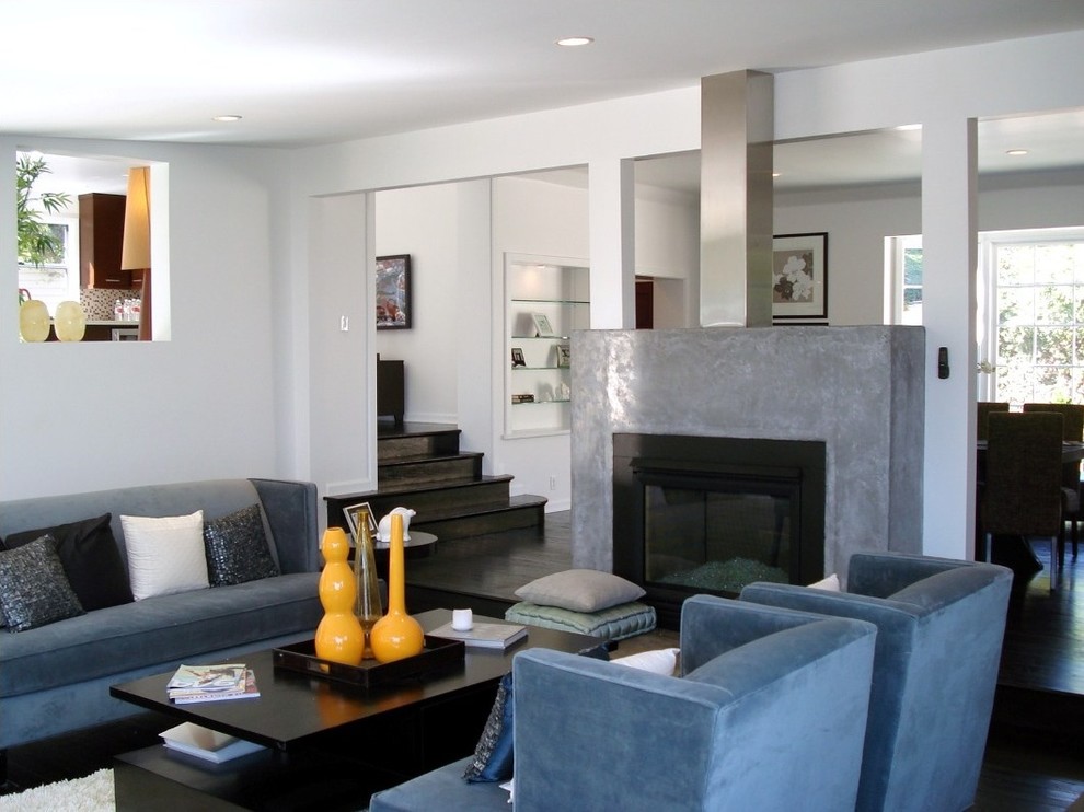 Example of a mid-sized trendy formal and open concept dark wood floor living room design in Los Angeles with white walls, a two-sided fireplace, a metal fireplace and no tv