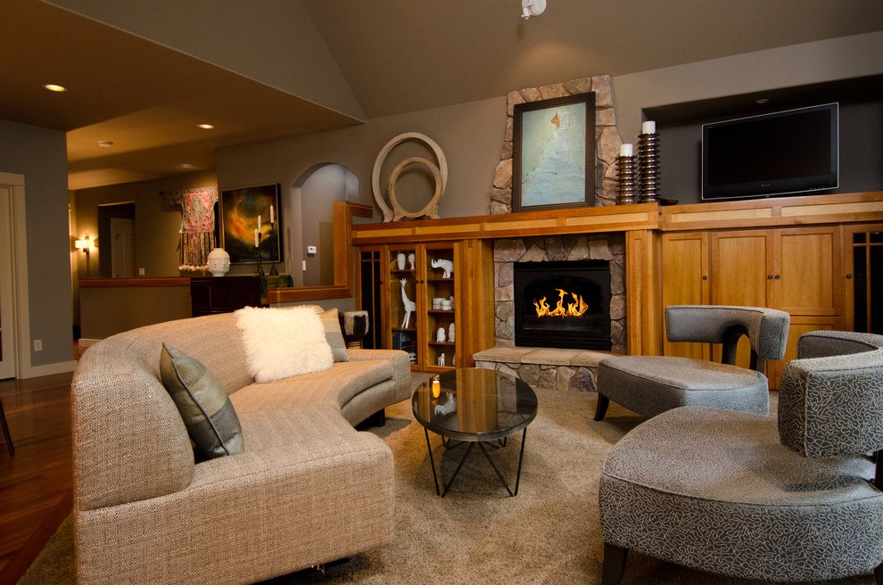 Trendy living room photo in Portland with gray walls, a standard fireplace and a stone fireplace