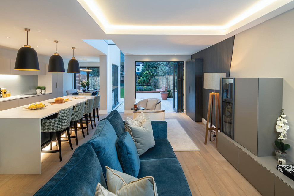 This is an example of a contemporary living room in London with feature lighting.