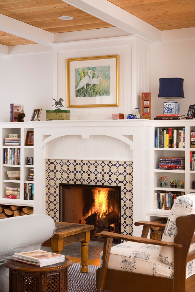 Country living room photo in Other with a tile fireplace