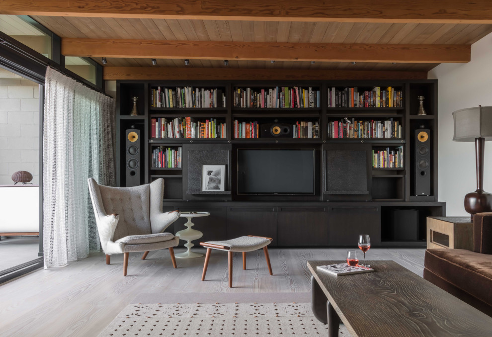 Design ideas for a midcentury open plan living room in Seattle with white walls, light hardwood flooring, a built-in media unit, beige floors, exposed beams, a vaulted ceiling and a wood ceiling.