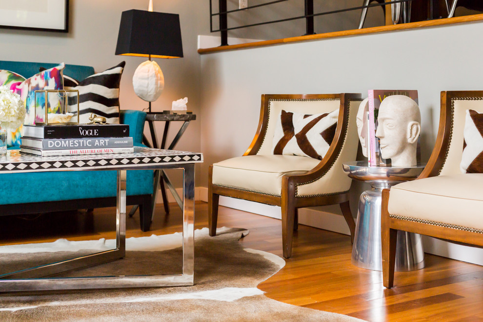 Medium sized contemporary open plan living room in Seattle with white walls and medium hardwood flooring.