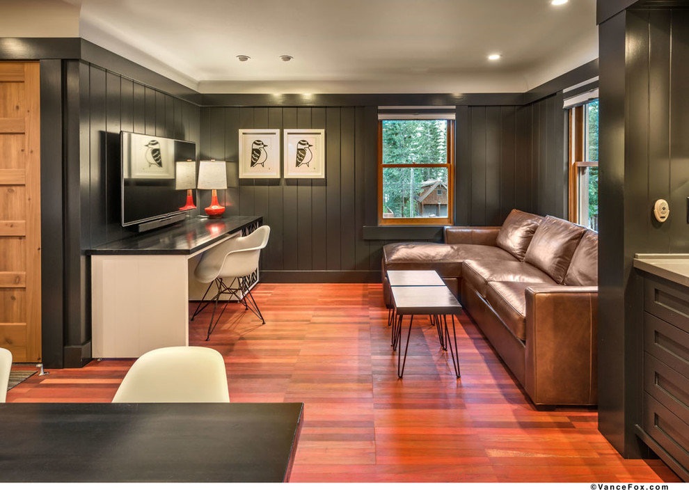 Inspiration for a small traditional open plan living room in Sacramento with black walls, medium hardwood flooring, no fireplace and a wall mounted tv.