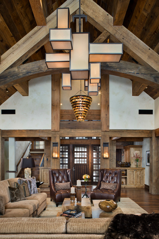 Inspiration for a rustic open concept dark wood floor living room remodel in Other