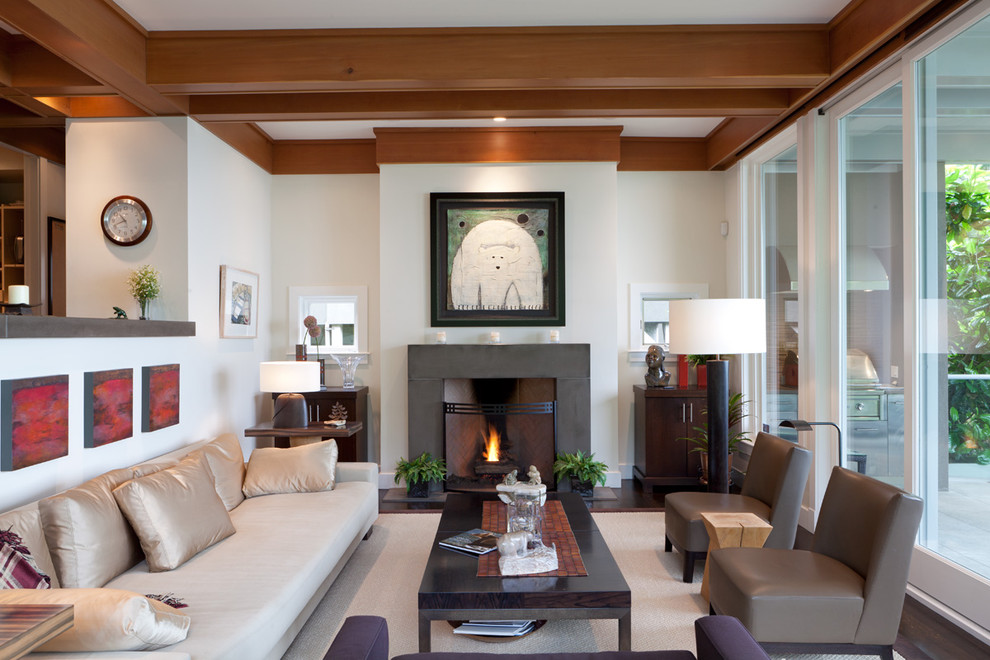 Large contemporary living room in Vancouver with white walls and a standard fireplace.