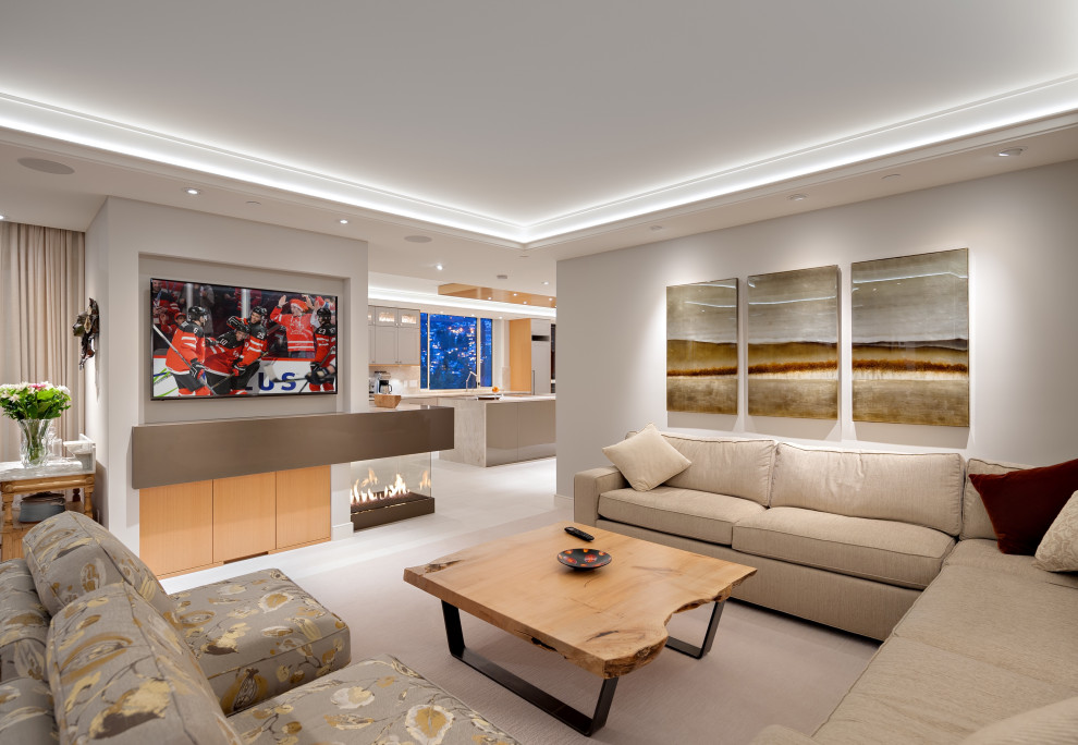 Esempio di un grande soggiorno design aperto con pareti grigie, moquette, pavimento grigio e soffitto ribassato