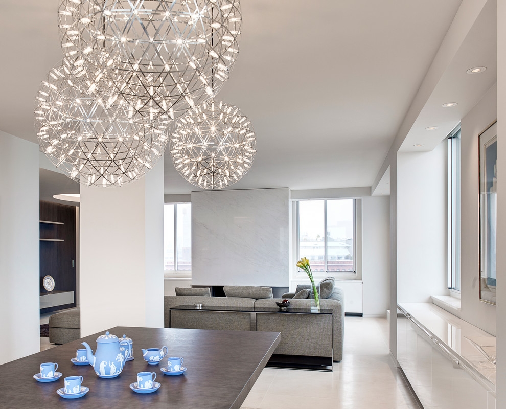 Inspiration for a mid-sized contemporary open concept concrete floor and beige floor living room remodel in New York with white walls