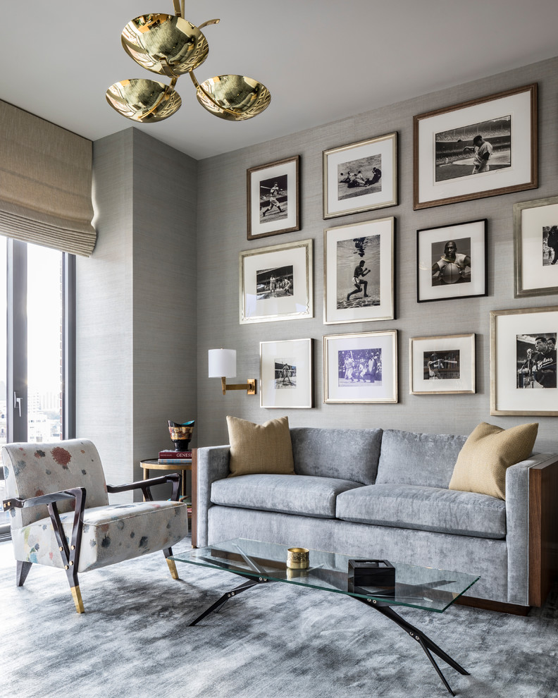 This is an example of a contemporary living room in New York with grey walls.