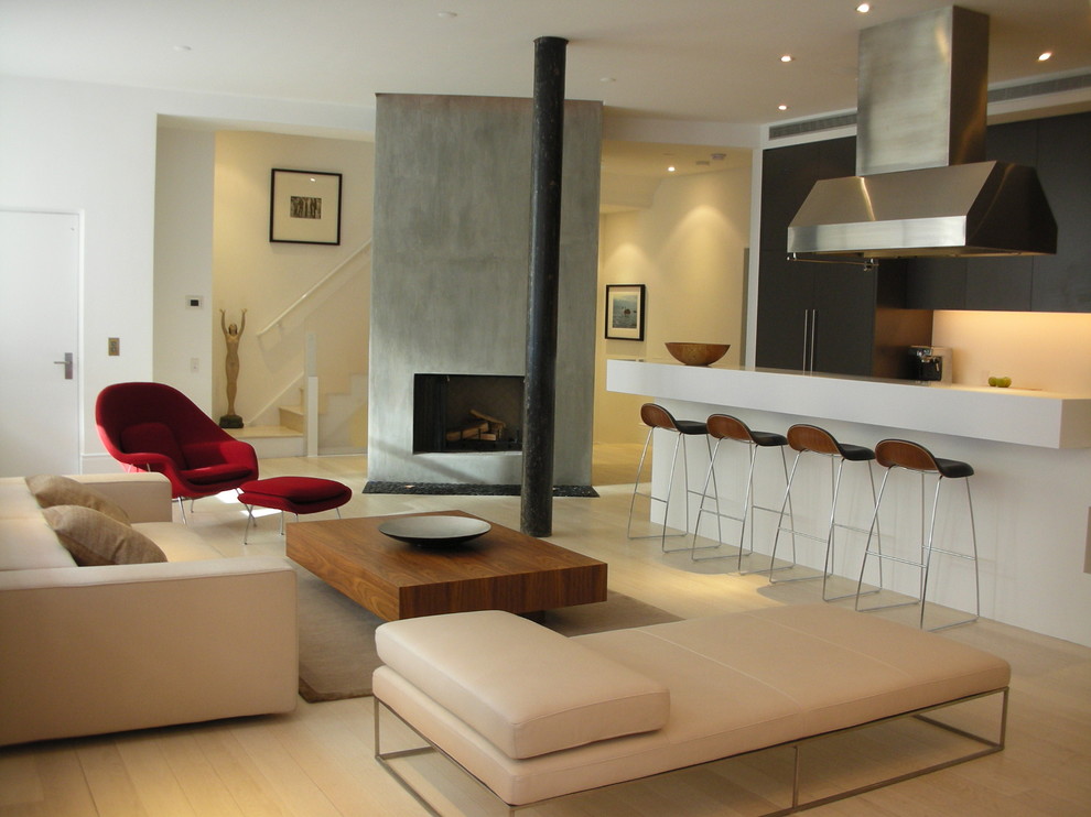 Inspiration for a contemporary open concept living room remodel in New York with a concrete fireplace