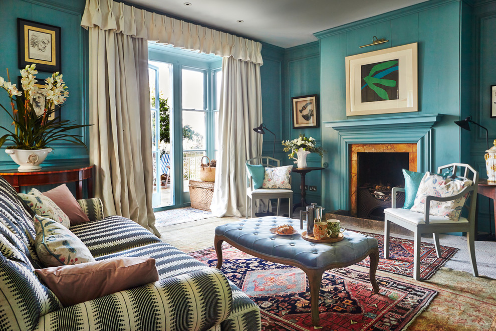 Design ideas for a large eclectic formal open plan living room in Hampshire with blue walls, carpet, a standard fireplace, a stone fireplace surround, no tv and multi-coloured floors.