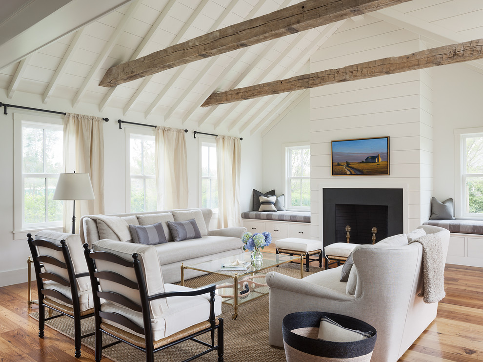 Photo of a farmhouse living room in Boston with white walls.