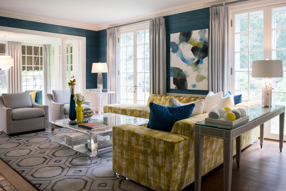 This is an example of a large traditional formal and grey and teal open plan living room in Boston with blue walls, light hardwood flooring and orange floors.