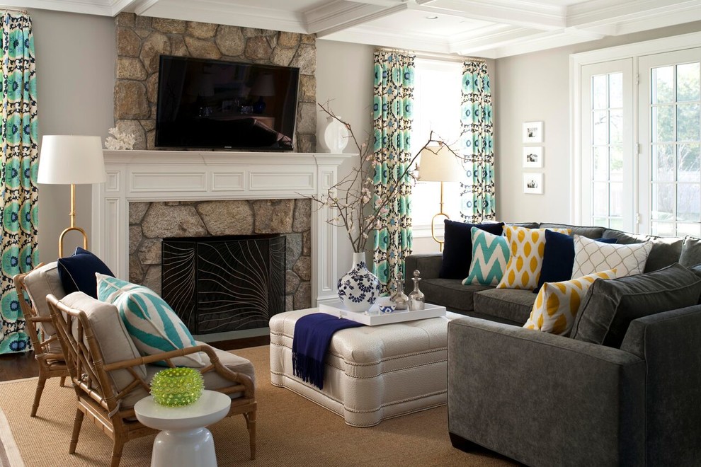 Design ideas for a medium sized classic formal and grey and teal enclosed living room in New York with grey walls, a standard fireplace, a stone fireplace surround, a wall mounted tv, dark hardwood flooring, brown floors and feature lighting.