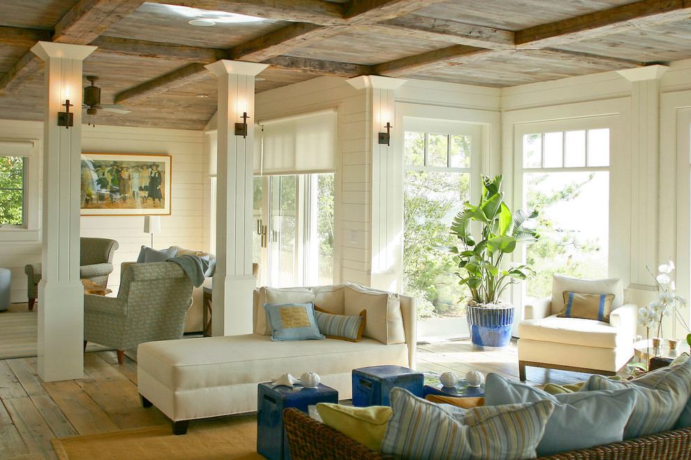 Example of a large classic formal and open concept medium tone wood floor living room design in Bridgeport with white walls and no fireplace