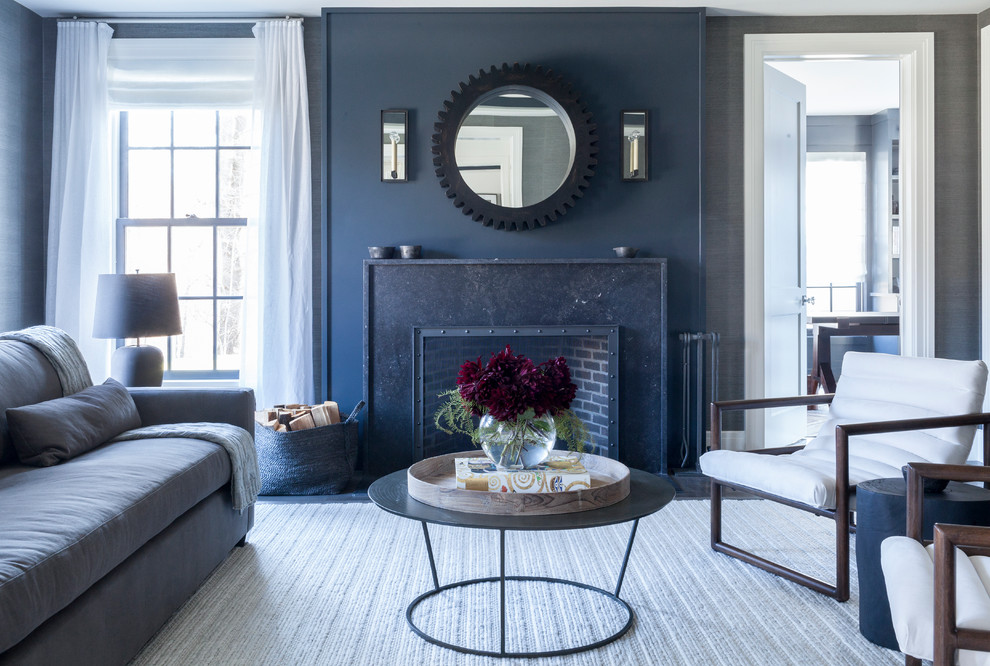 Design ideas for an expansive classic formal open plan living room in New York with grey walls, dark hardwood flooring, a standard fireplace, a stone fireplace surround, no tv and feature lighting.