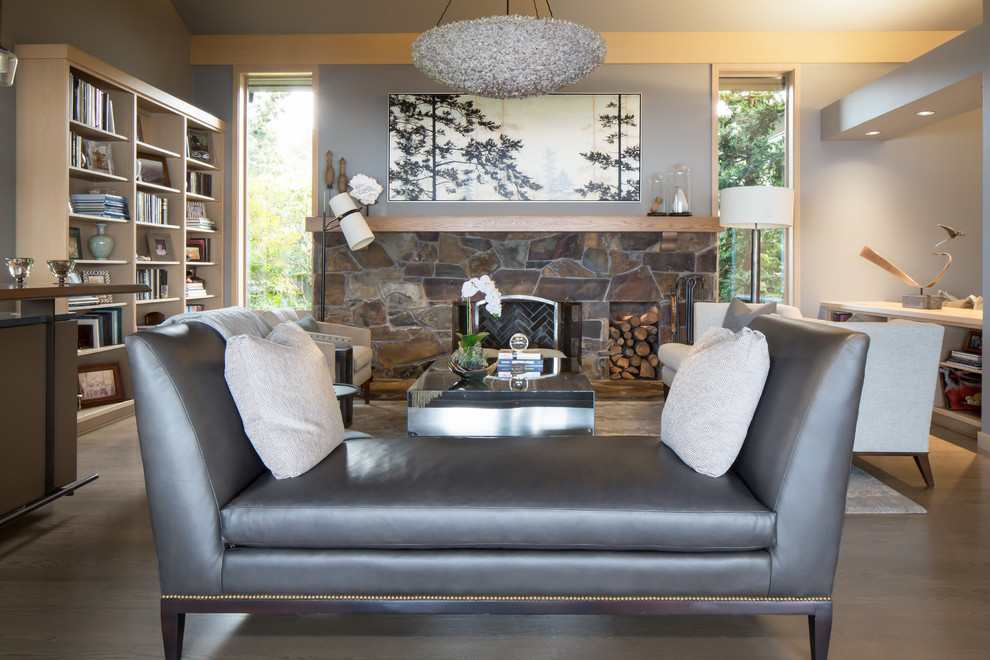 Inspiration for a large contemporary formal open plan living room in Seattle with grey walls, medium hardwood flooring, a standard fireplace, a stone fireplace surround, no tv and brown floors.