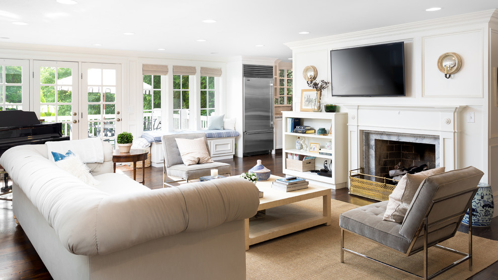 Inspiration for a medium sized traditional formal open plan living room in Salt Lake City with white walls, dark hardwood flooring, a standard fireplace, a stone fireplace surround, a wall mounted tv and brown floors.