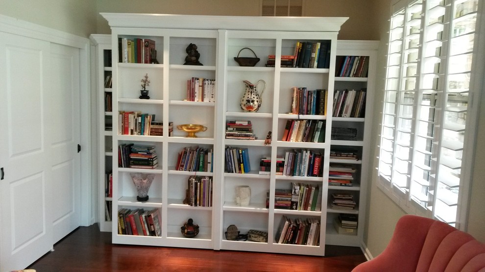 White Murphy Bed with pivoting Library bookcases Mediterranean
