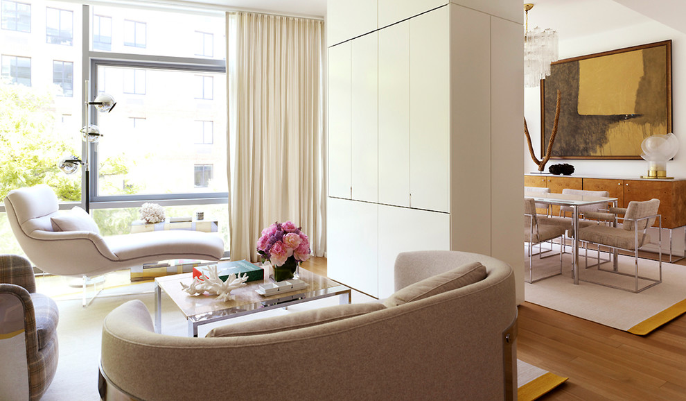 Mid-sized trendy open concept light wood floor living room photo in New York with white walls, no fireplace and a concealed tv