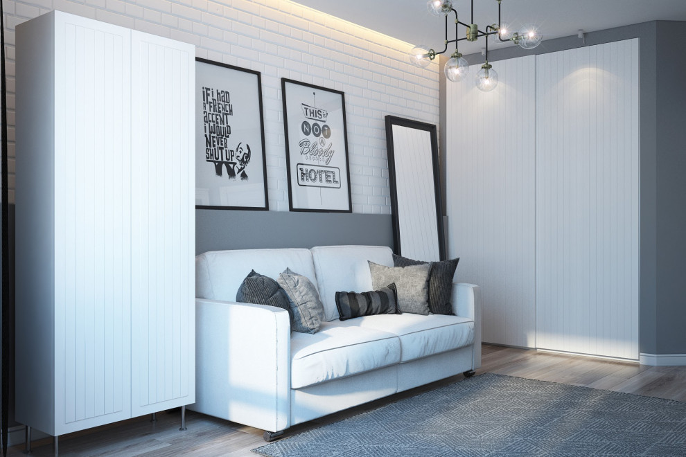 На фото: двухуровневая гостиная комната в скандинавском стиле с серыми стенами, полом из ламината, телевизором на стене, бежевым полом, кессонным потолком и панелями на части стены с