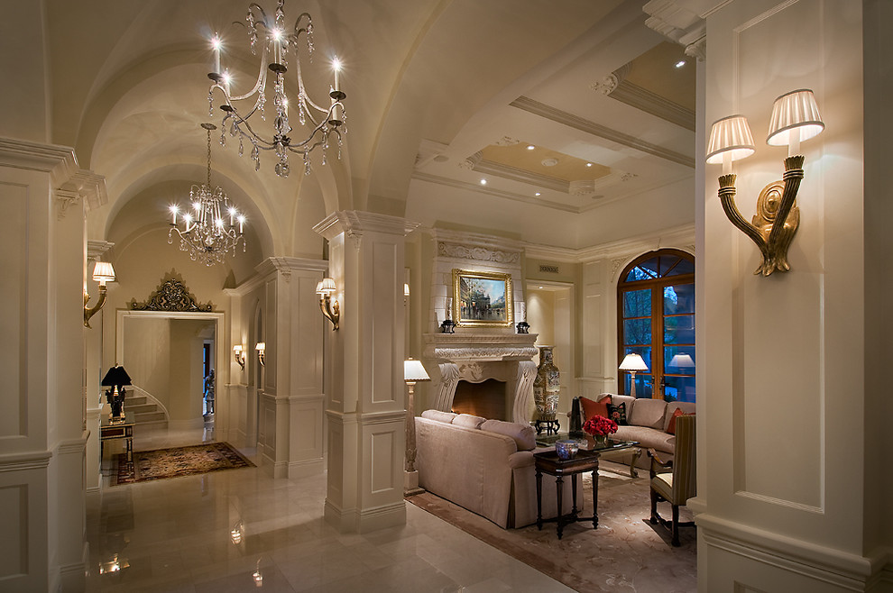 Идея дизайна: парадная, изолированная гостиная комната в средиземноморском стиле с белыми стенами, мраморным полом и стандартным камином