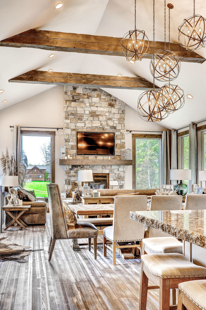 Photo of a rustic formal living room in Other with white walls, light hardwood flooring, a standard fireplace, a stone fireplace surround and a wall mounted tv.
