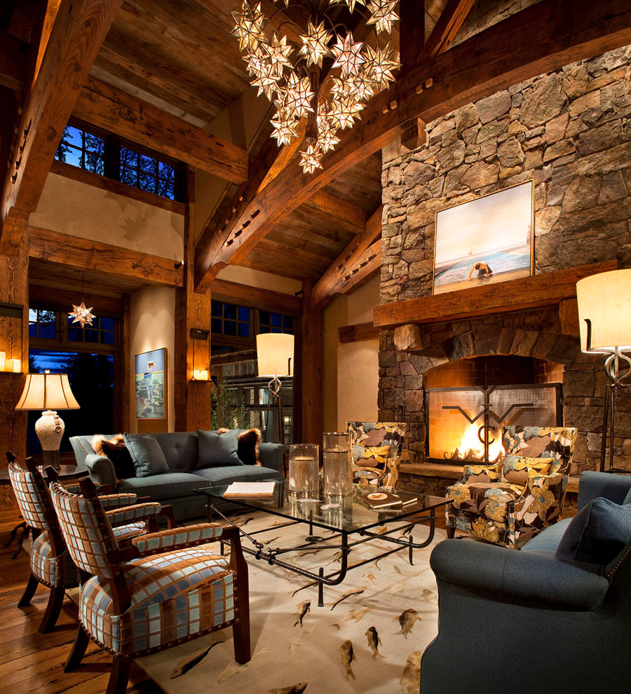 Design ideas for a rustic open plan living room in Other with a standard fireplace and a stone fireplace surround.