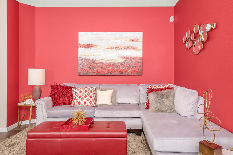 На фото: парадная, изолированная гостиная комната среднего размера в современном стиле с красными стенами и полом из керамогранита без камина, телевизора с