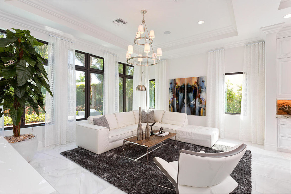 Inspiration for a contemporary living room in Miami with white walls.