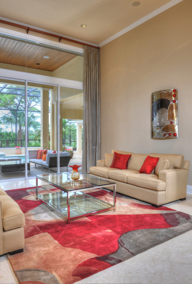 Living room - contemporary open concept travertine floor and beige floor living room idea in Miami with beige walls