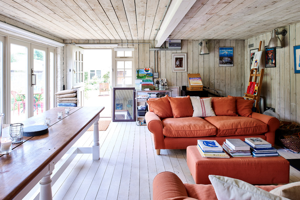 Farmhouse formal and enclosed painted wood floor and white floor living room photo in London with beige walls
