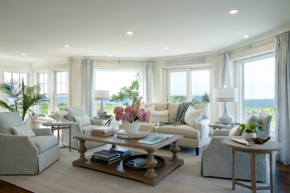 Example of a beach style dark wood floor and brown floor living room design in Boston with beige walls