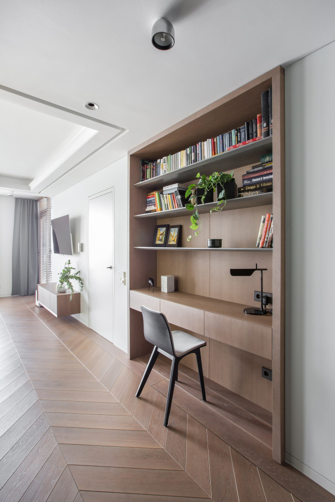 Photo of a living room in London with light hardwood flooring and pink floors.