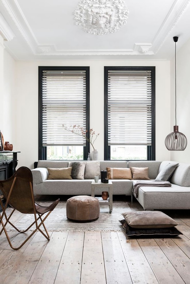 Medium sized scandi open plan living room in Melbourne with white walls, light hardwood flooring and beige floors.