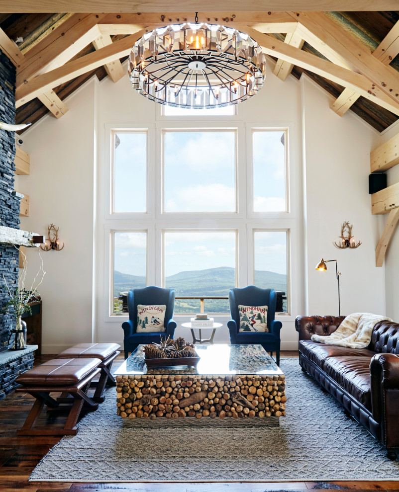 Large mountain style formal and open concept dark wood floor, brown floor and exposed beam living room photo in New York with white walls, a standard fireplace and a brick fireplace