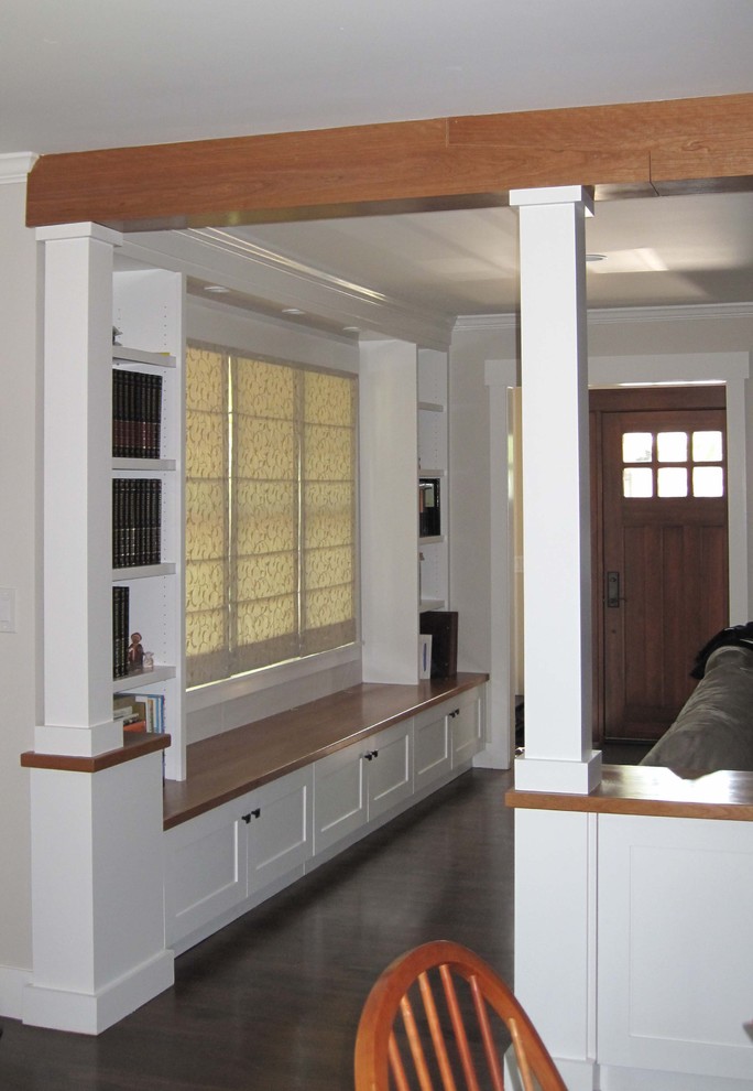 Example of a mid-sized classic open concept dark wood floor living room library design in San Francisco with white walls