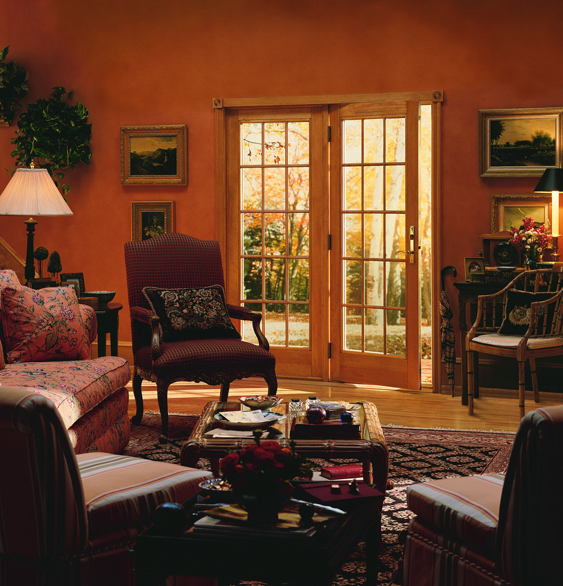 Foto di un soggiorno tradizionale di medie dimensioni e aperto con sala formale, pareti arancioni, nessun camino e nessuna TV