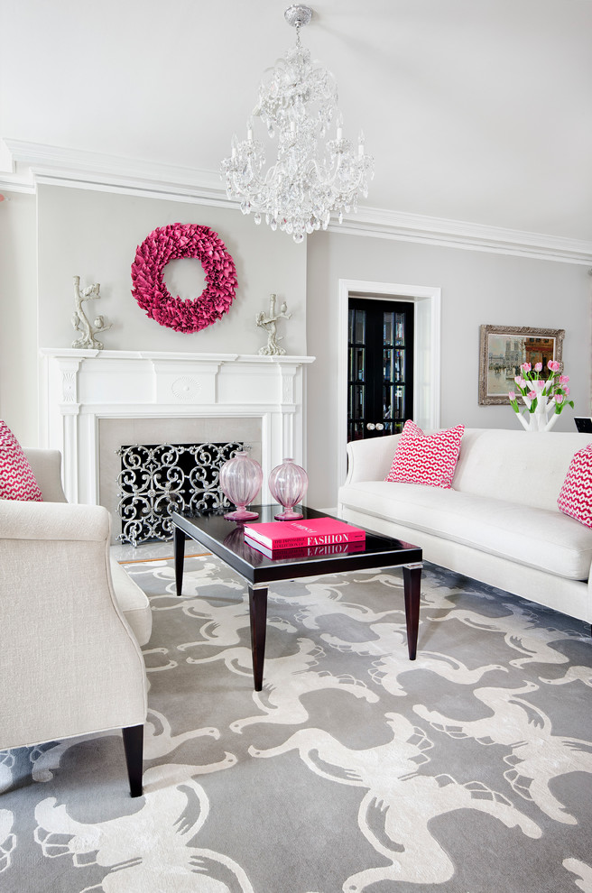 Inspiration for a transitional medium tone wood floor living room remodel in Minneapolis with gray walls, a standard fireplace and a stone fireplace