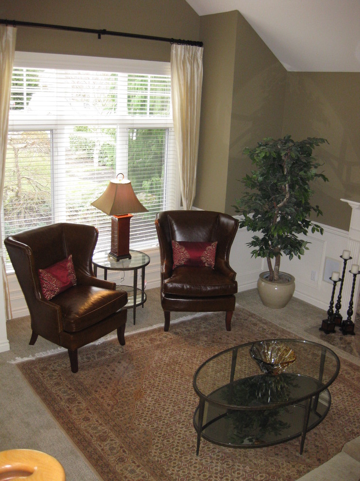 Example of a mid-sized classic carpeted living room design in Seattle with green walls and a standard fireplace