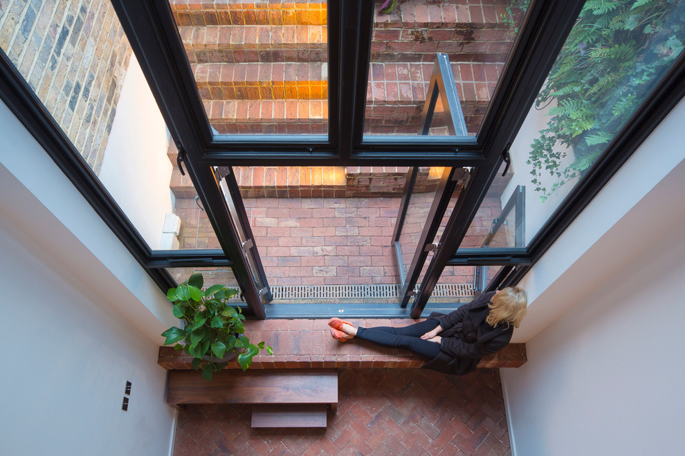 Small urban open concept living room photo in London