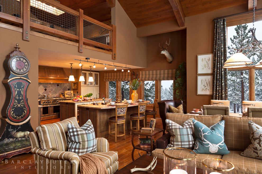 Example of a mountain style formal and loft-style medium tone wood floor living room design in Orange County with brown walls