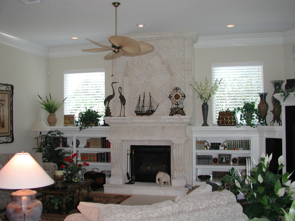 Photo of a medium sized traditional open plan living room in Jacksonville with a reading nook, beige walls, porcelain flooring, a standard fireplace, a stone fireplace surround and a corner tv.