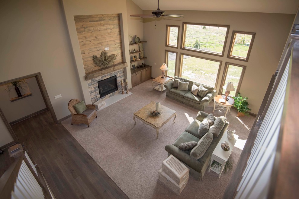 Living room - large traditional formal and open concept carpeted and brown floor living room idea in Milwaukee with beige walls, a standard fireplace, a stone fireplace and a concealed tv